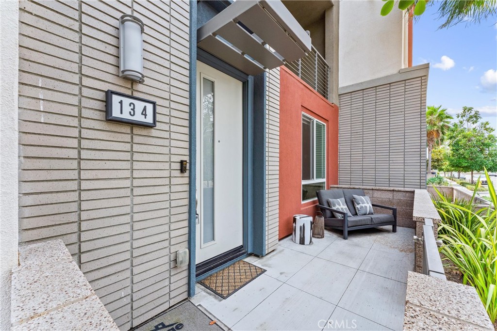 134 Citysquare Irvine, CA 92614 - Photo 3 of 32 a view of patio with a table and chairs and potted plants