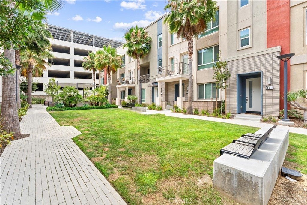 134 Citysquare Irvine, CA 92614 - Photo 31 of 32 a view of a house with a yard