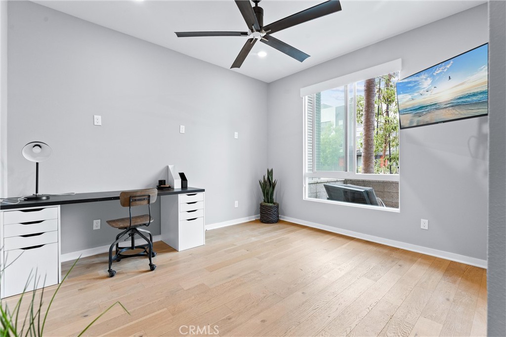 134 Citysquare Irvine, CA 92614 - Photo 5 of 32 a view of a workspace with furniture and a window