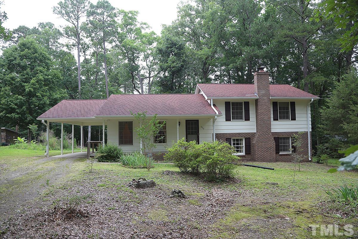 1337 Clermont Road Durham, NC 27713 - Photo 1 of 16 a front view of a house with a garden