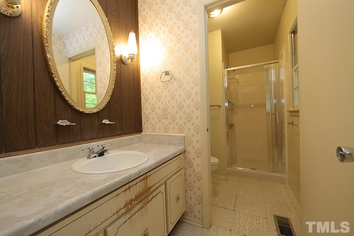 1337 Clermont Road Durham, NC 27713 - Photo 11 of 16 a bathroom with a sink and a mirror