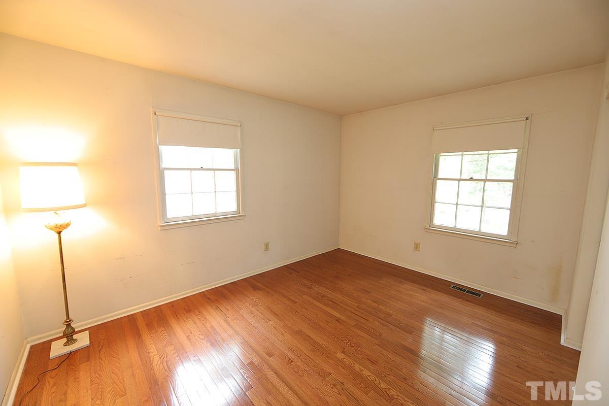 1337 Clermont Road Durham, NC 27713 - Photo 14 of 16 a view of a room with wooden floor and a window