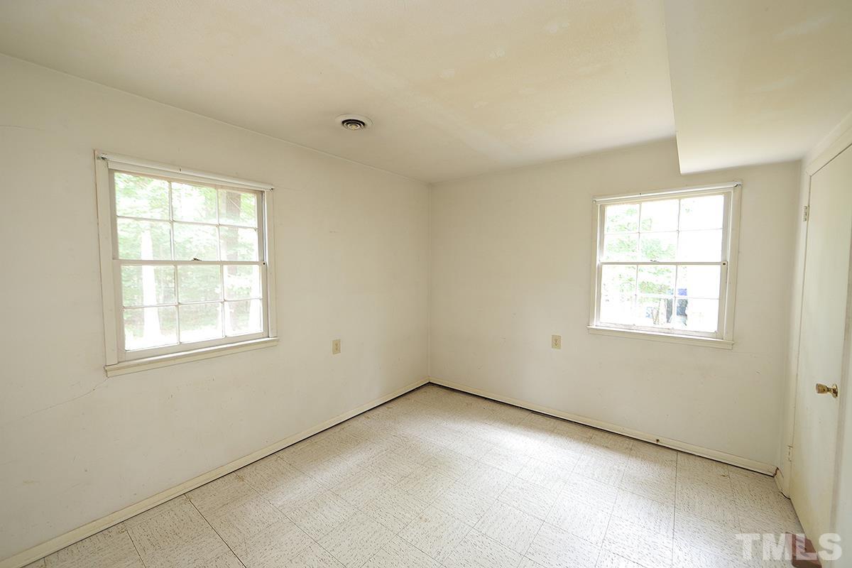 1337 Clermont Road Durham, NC 27713 - Photo 5 of 16 an empty room with a window