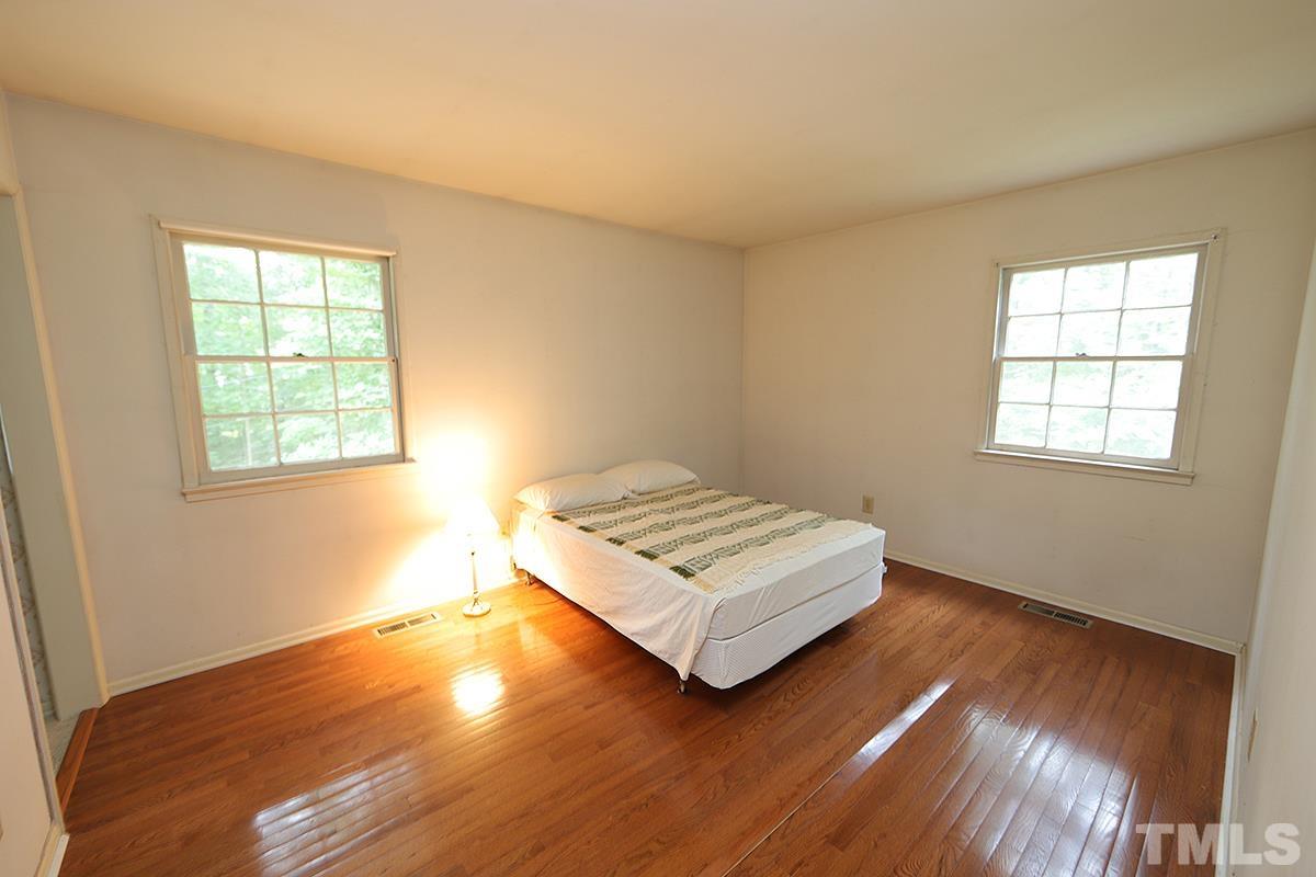 1337 Clermont Road Durham, NC 27713 - Photo 10 of 16 a bedroom with a bed and a window