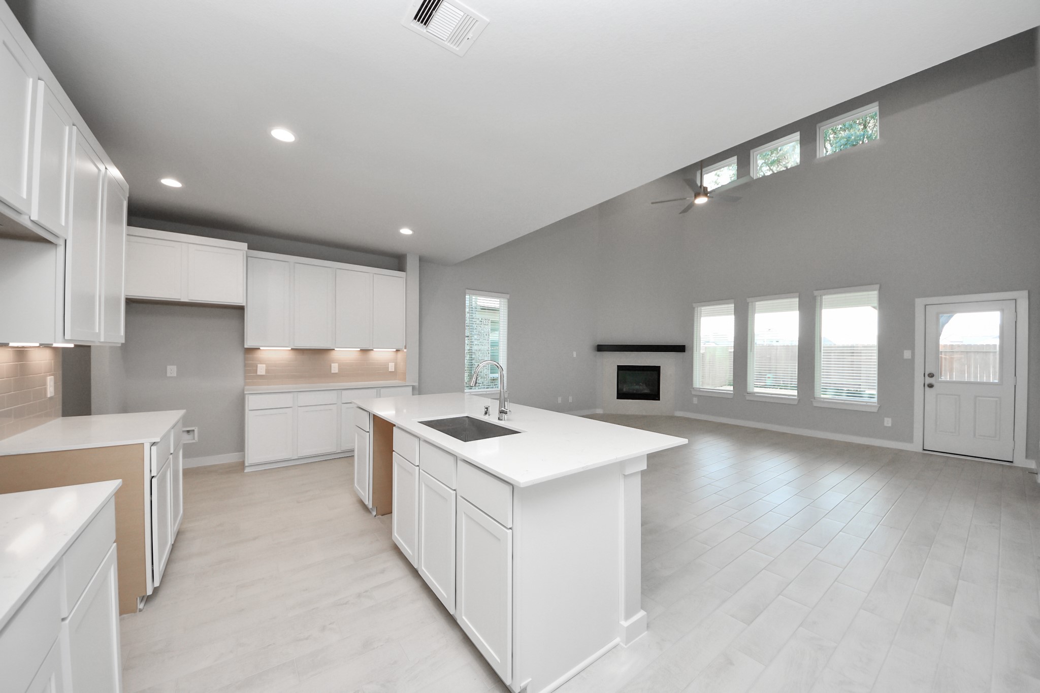 15719 Telge Ridge Lane Cypress, TX 77429 - Photo 15 of 48 a kitchen with a stove sink and cabinets