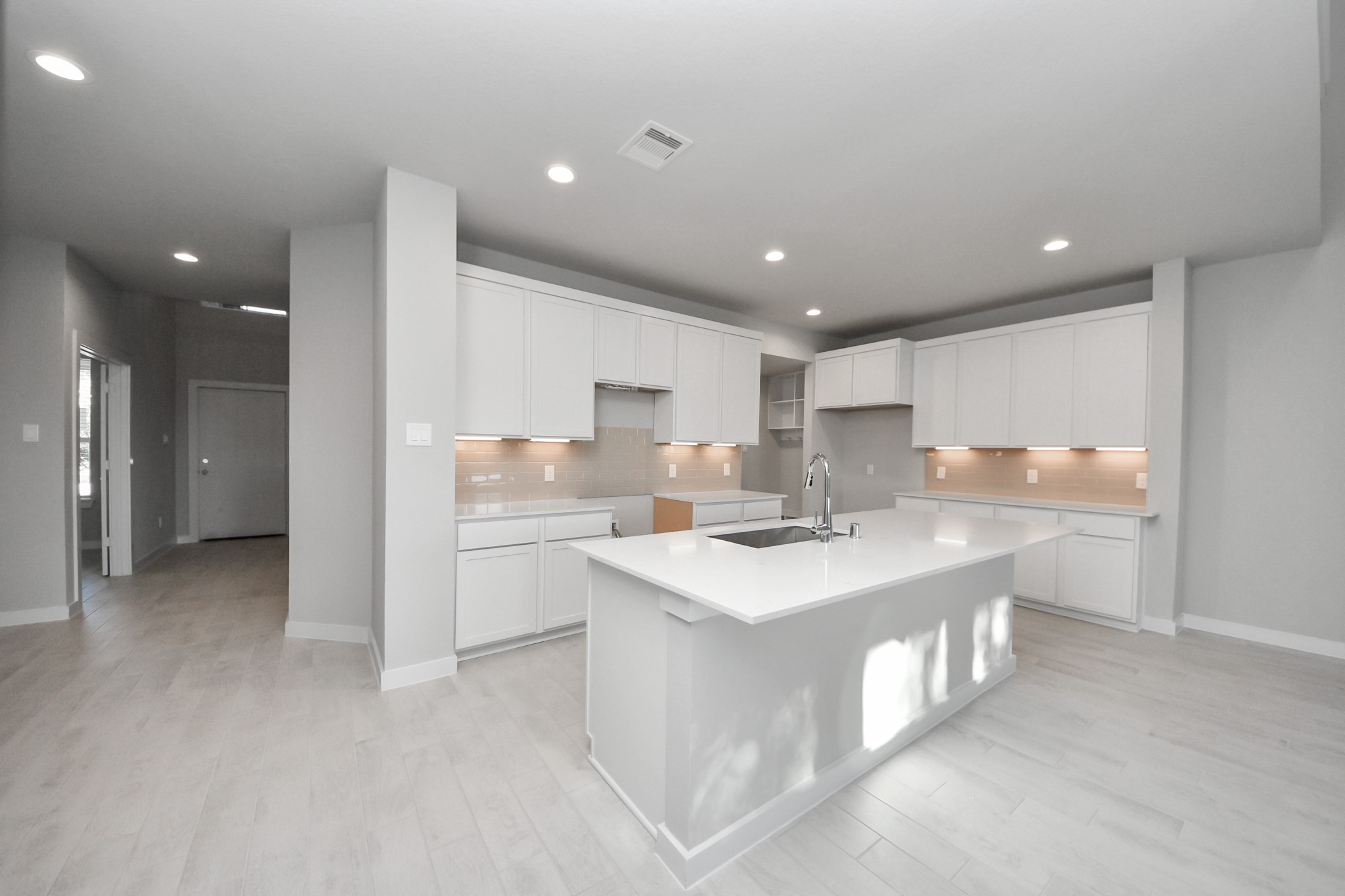15719 Telge Ridge Lane Cypress, TX 77429 - Photo 16 of 48 a kitchen with a sink stove and cabinets