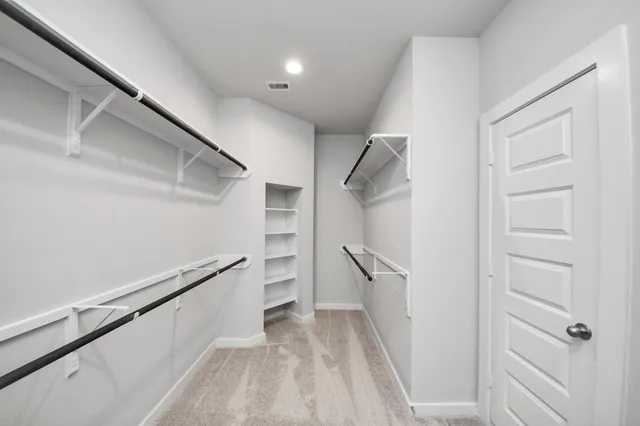 a view of a hallway with windows