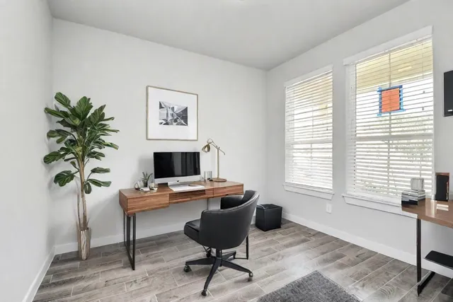 an empty room with windows and with windows