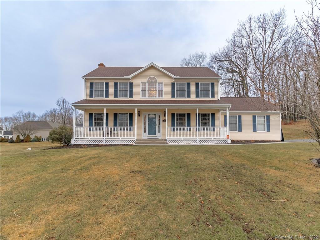 188 Westgate Road Watertown, CT 06795 - Photo 1 of 1 a front view of a house with a garden and lake view