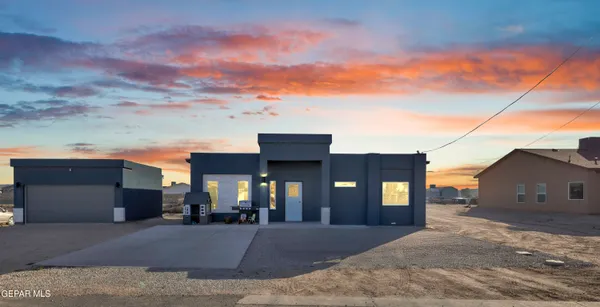 a view of a house next to a yard
