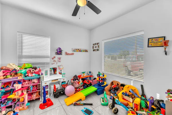 a bedroom with furniture and a chair