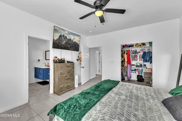 a bathroom with a sink mirror and vanity