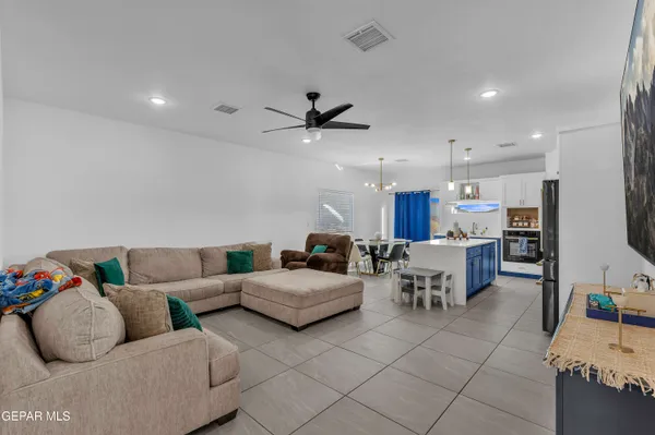 a living room with furniture and a rug
