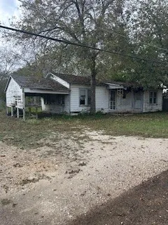 a house with a tree in front of it
