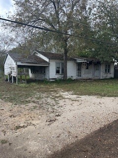 a house with a tree in front of it
