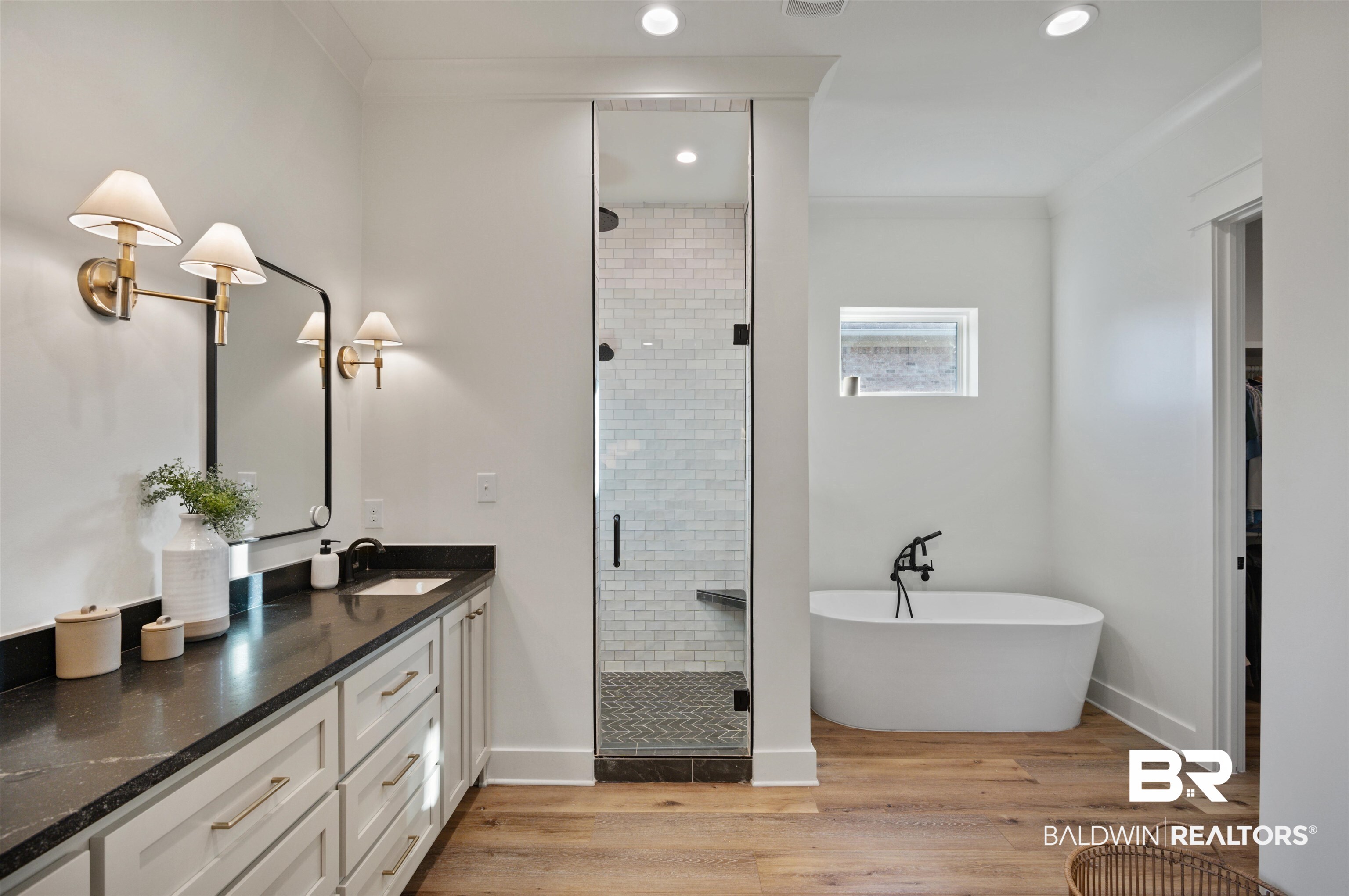 312 Pecan Ridge Boulevard Fairhope, AL 36532 - Photo 26 of 43 Bathroom with wood-type flooring, vanity, ornamental molding, and plus walk in shower