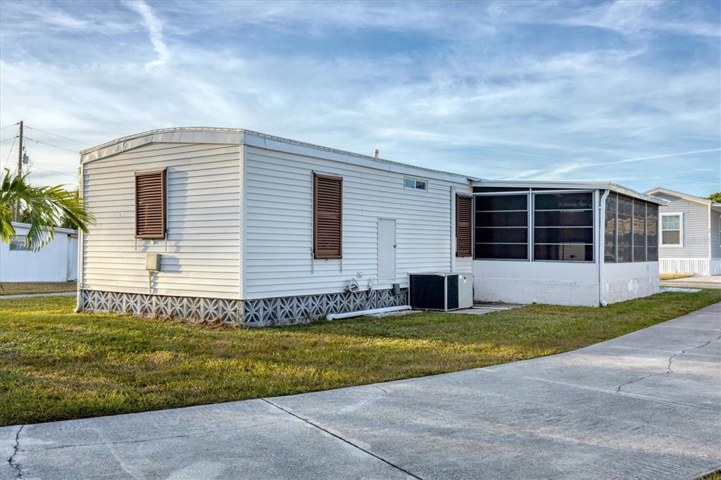 1891 Englewood Road, Unit 1 Englewood, FL 34223 - Photo 28 of 46 a view of a house with a patio