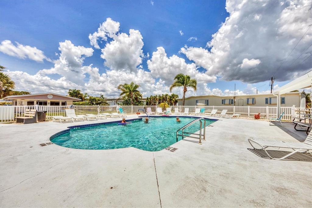 1891 Englewood Road, Unit 1 Englewood, FL 34223 - Photo 36 of 46 a view of multiple houses with a swimming pool