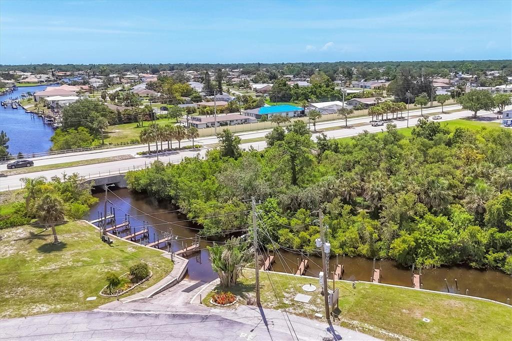 1891 Englewood Road, Unit 1 Englewood, FL 34223 - Photo 45 of 46 a view of swimming pool from a lake view