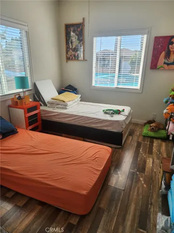 a bedroom with bed and window