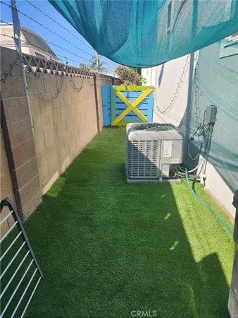 a view of a backyard with a small cabin