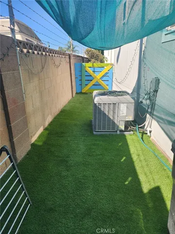 a view of a backyard with a small cabin