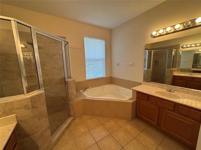 a bathroom with a bathtub and a sink