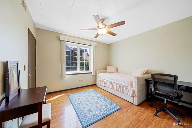 a bedroom with furniture and a window