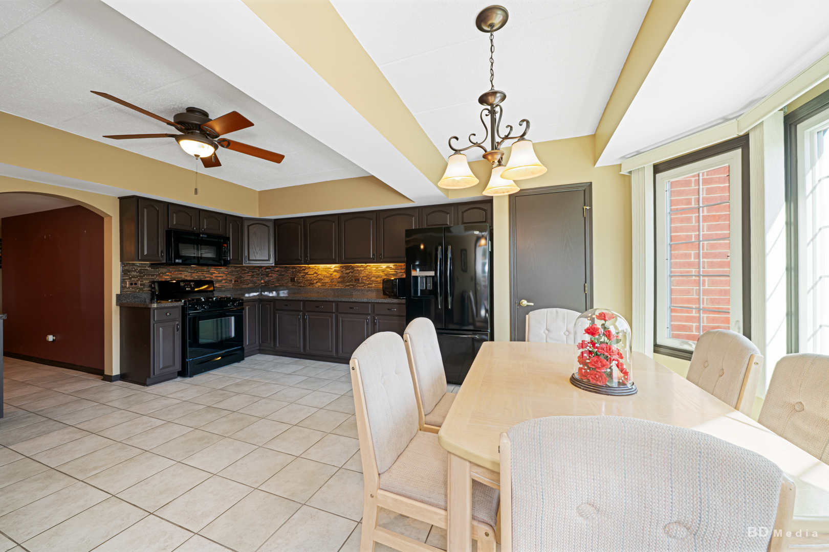 7928 Trinity Circle, Unit 2SW Tinley Park, IL 60487 - Photo 6 of 14 a living room with stainless steel appliances kitchen island granite countertop furniture and a kitchen view