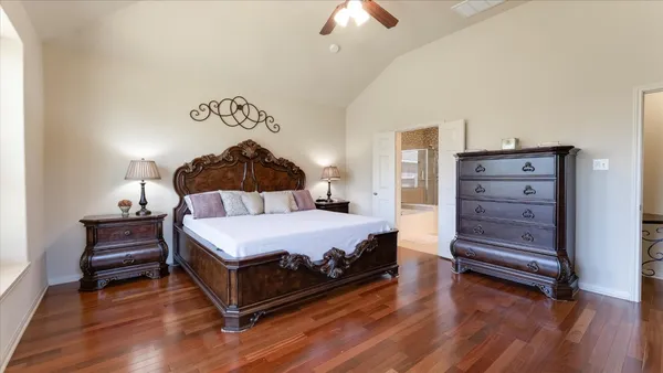 a spacious bathroom with a double vanity sink a mirror and a bathtub