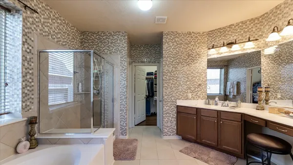 a bathroom with a sink double vanity and a mirror