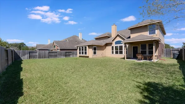 an aerial view of a house with swimming pool