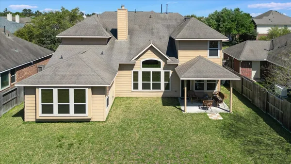 a view of a backyard with sitting area