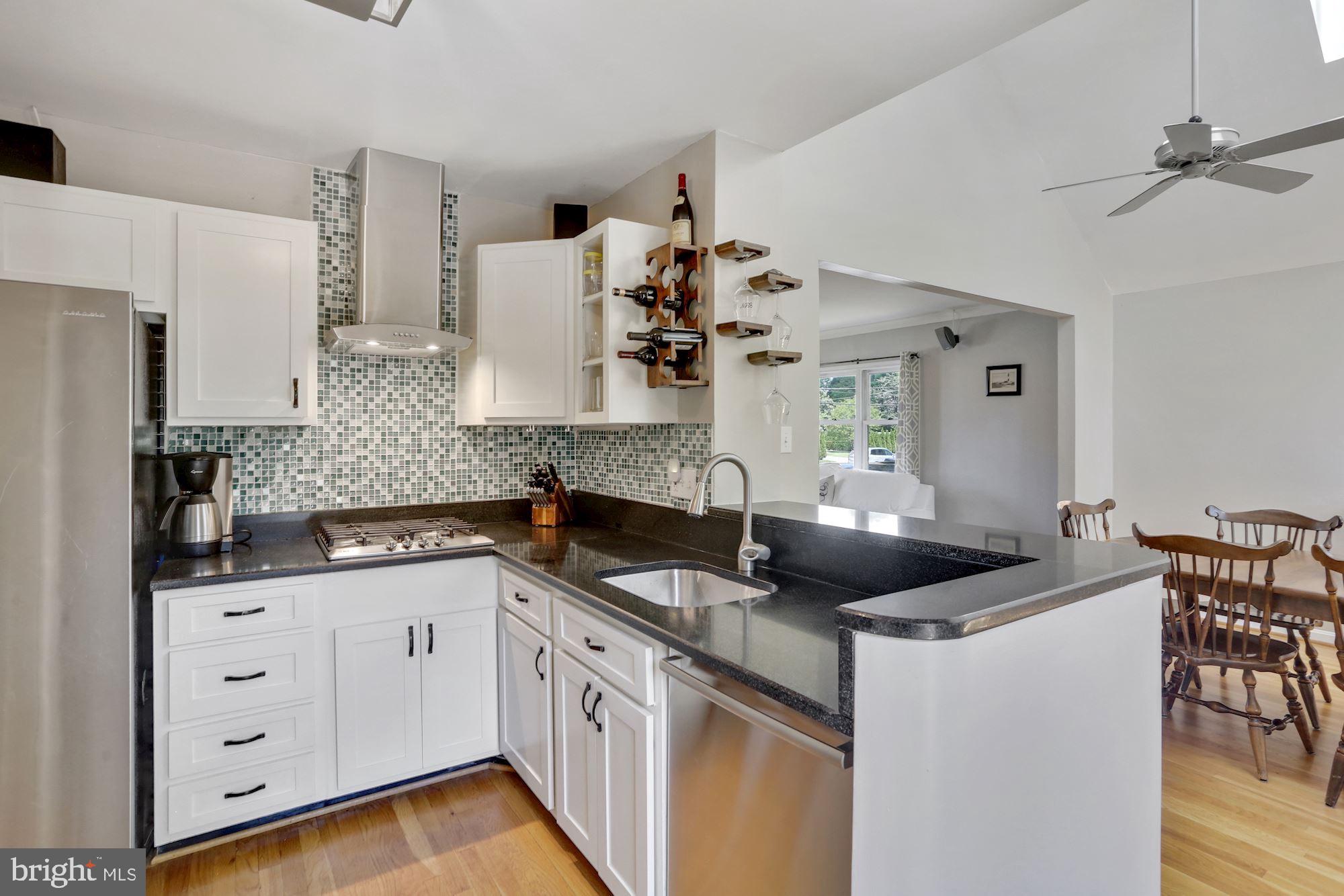 8405 Fort Hunt Road Alexandria, VA 22308 - Photo 7 of 35 Kitchen opens up to incredible dining addition