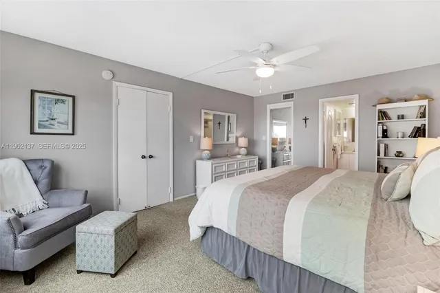 a spacious bedroom with a bed and a couch