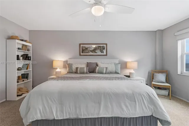 a bedroom with a bed and a lamp