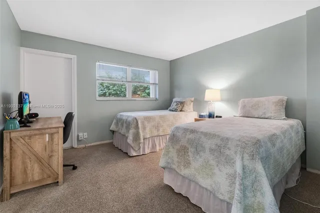 a bedroom with bed and a window