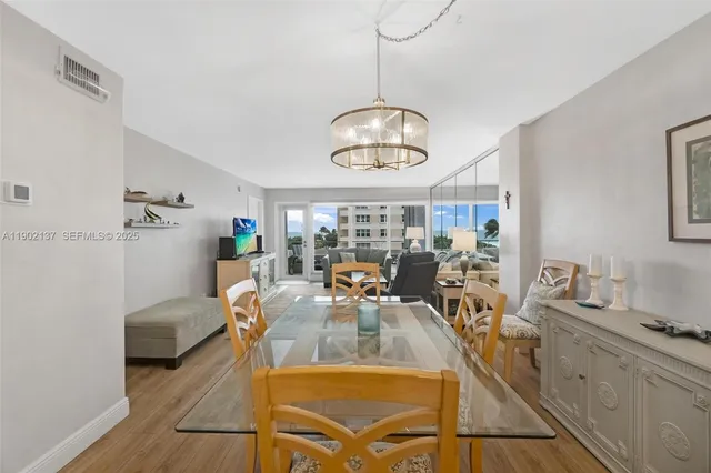 a view of a livingroom with furniture window and wooden floor