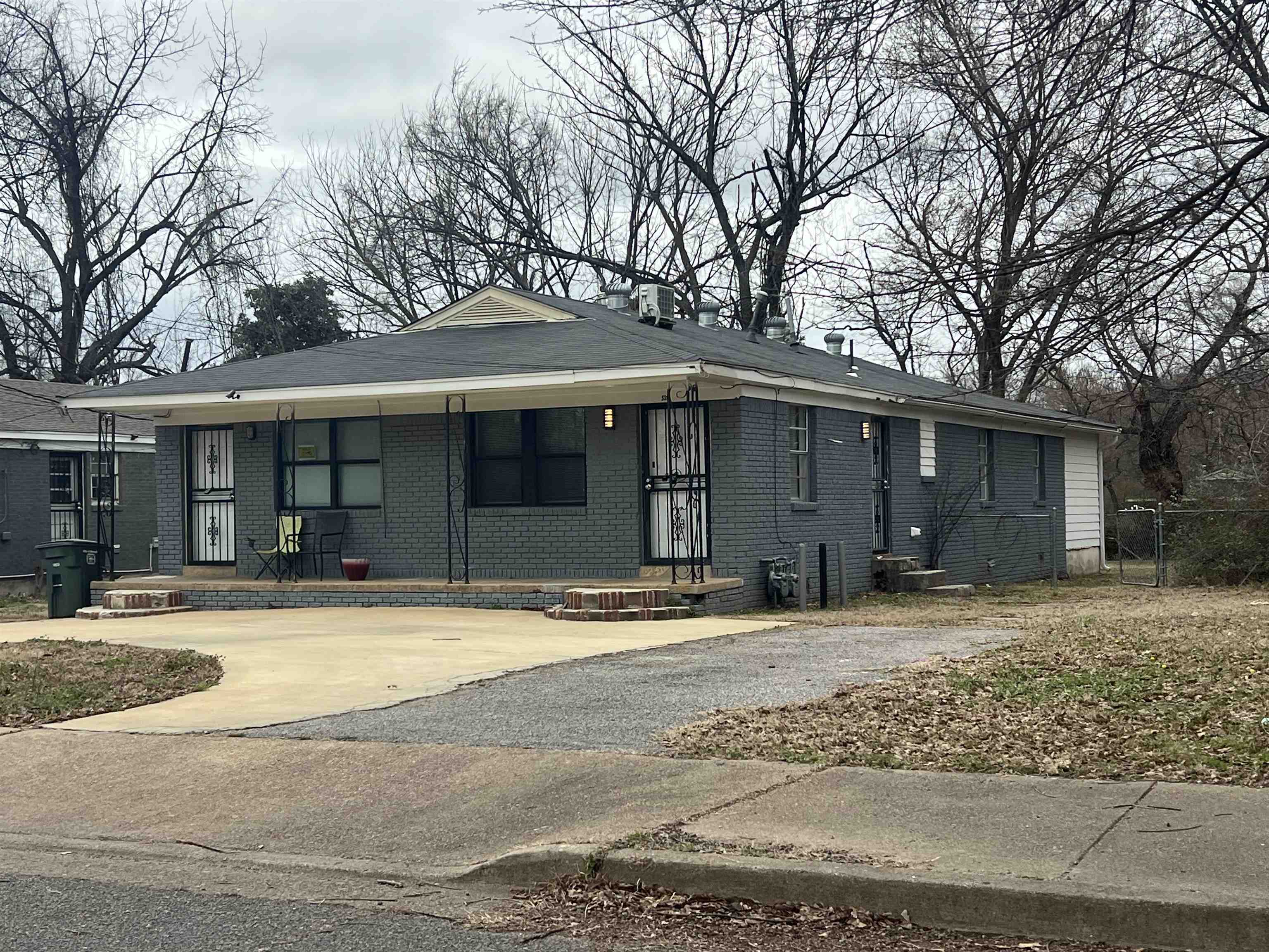 518 Harahan Road Memphis, TN 38109 - Photo 2 of 8 View of front of property featuring brick siding and covered porch