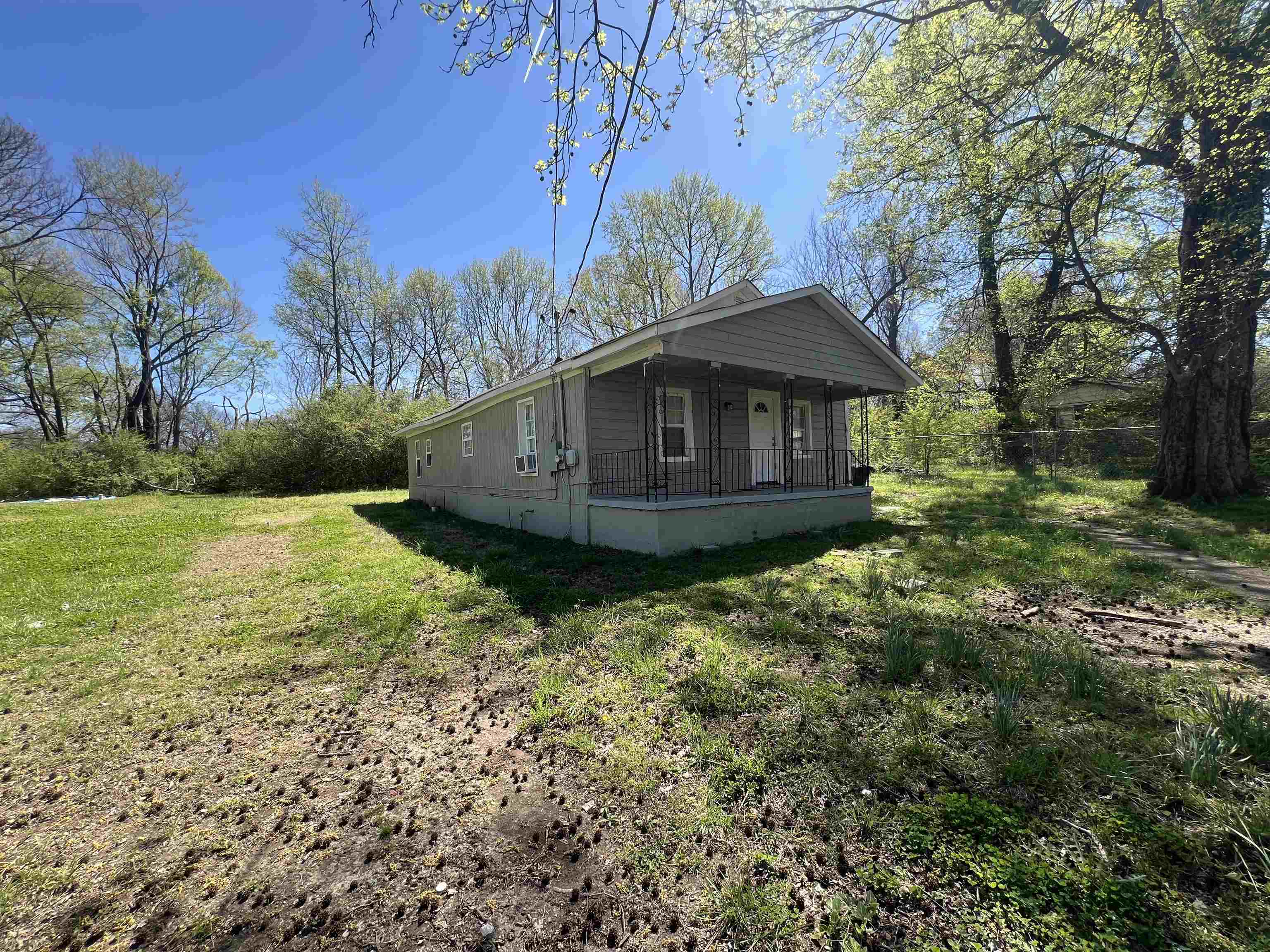 518 Harahan Road Memphis, TN 38109 - Photo 6 of 8 View of home's exterior with a lawn and cooling unit