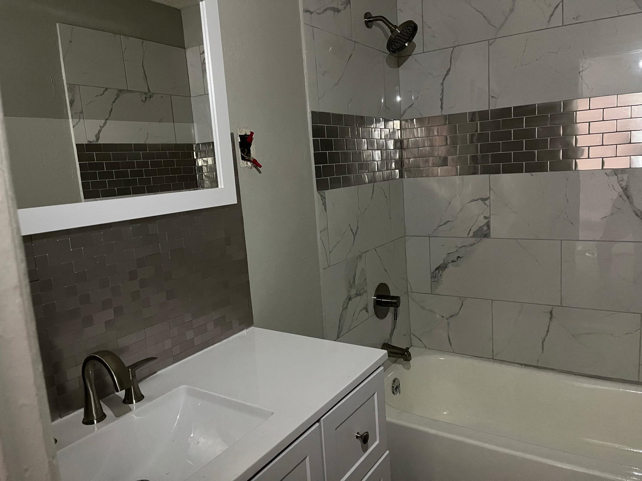 518 Harahan Road Memphis, TN 38109 - Photo 6 of 9 Full bath featuring vanity and tub / shower combination
