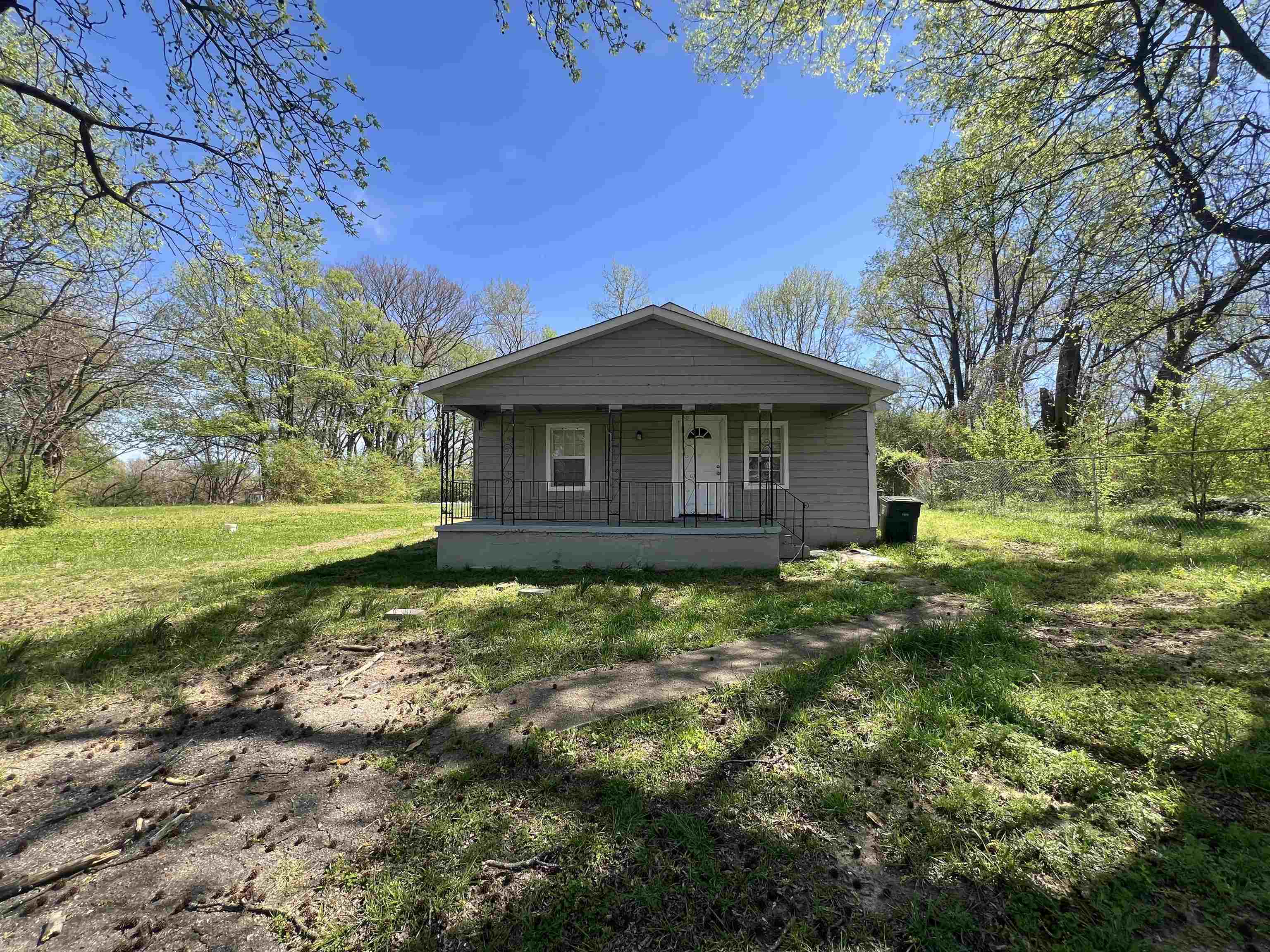 518 Harahan Road Memphis, TN 38109 - Photo 8 of 8 Bungalow-style home featuring covered porch, a front lawn, and view of scattered trees
