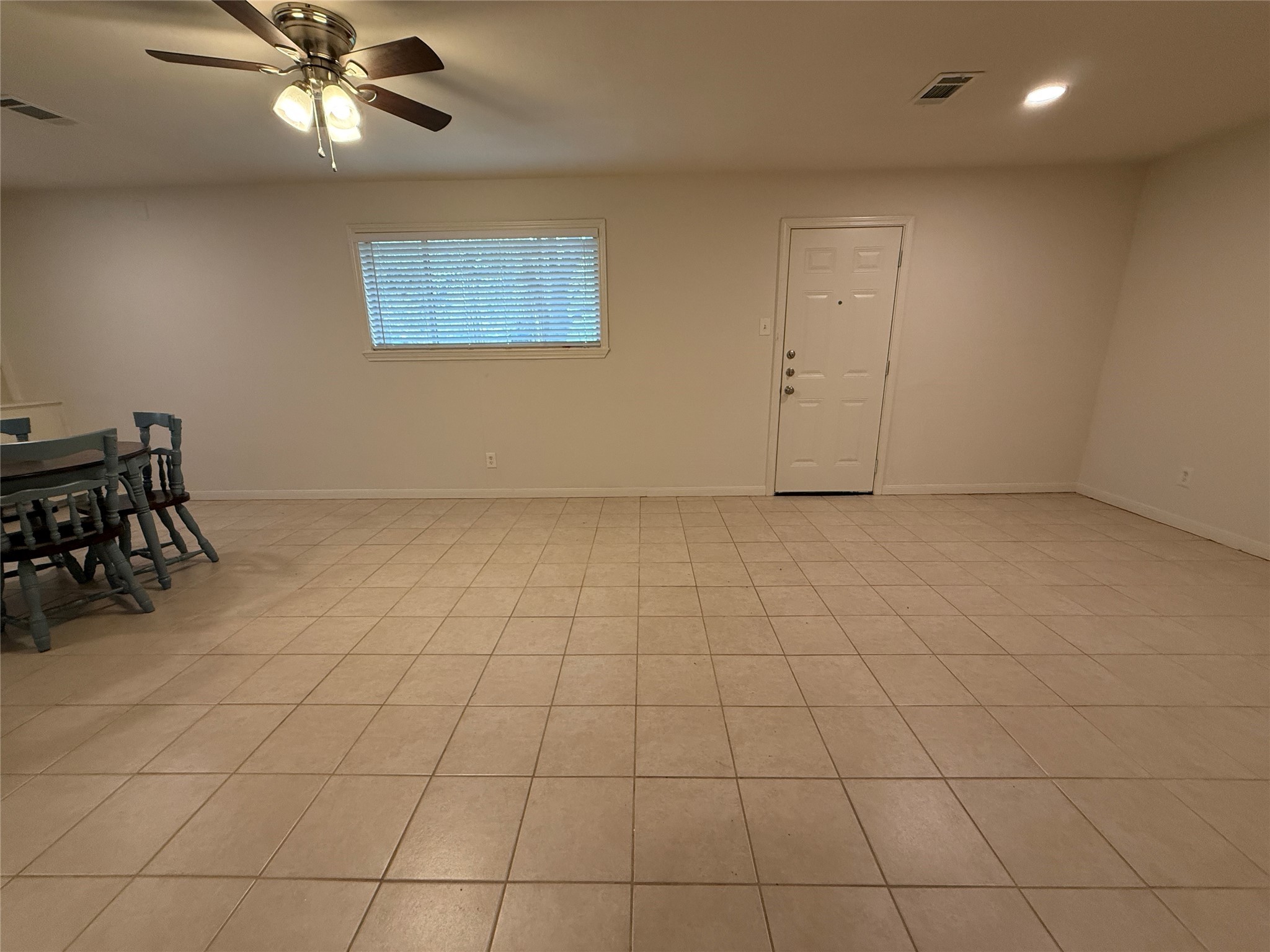2310 Pecos La Marque, TX 77568 - Photo 11 of 26 an empty room with windows and ceiling fan