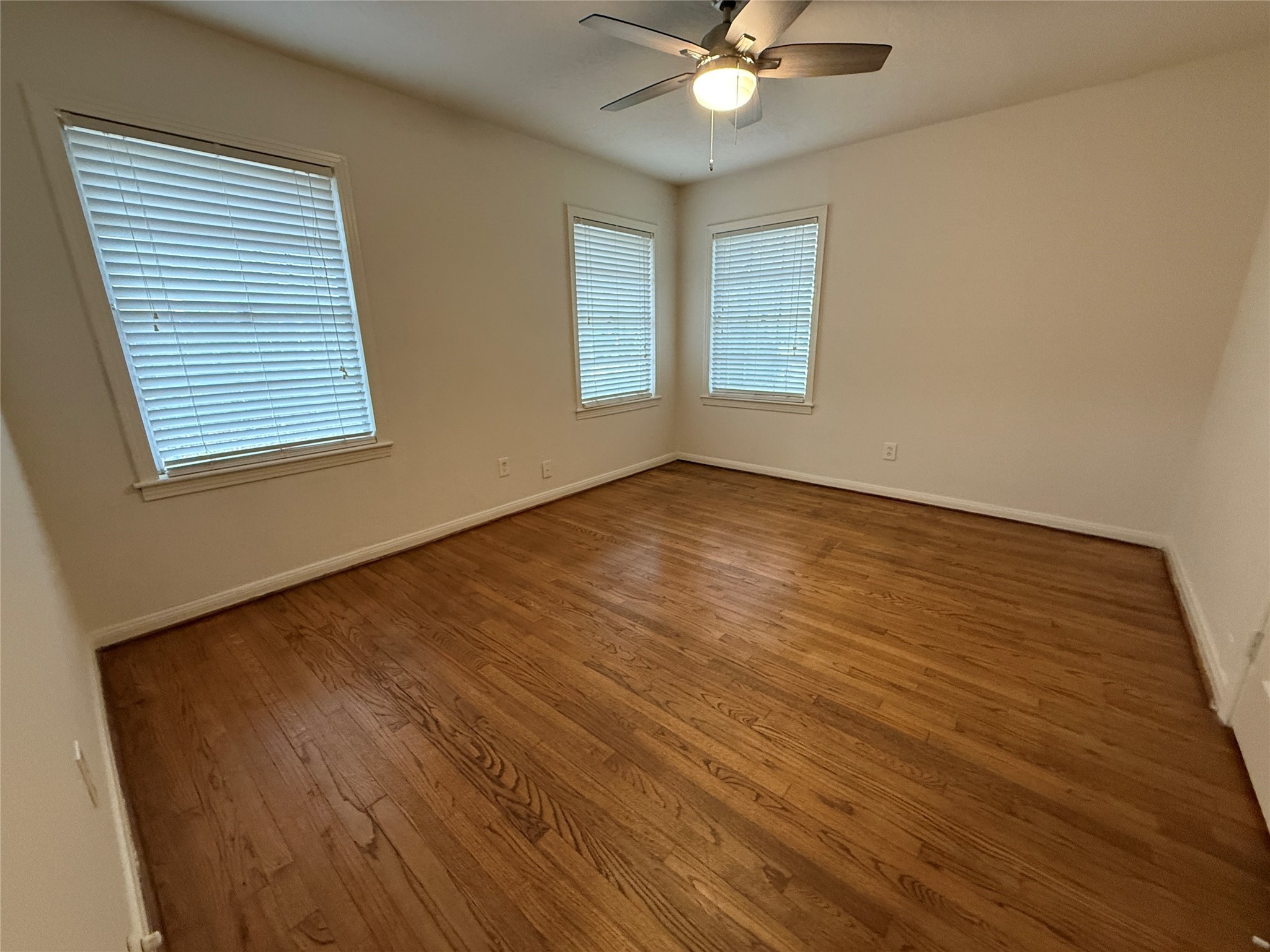 2310 Pecos La Marque, TX 77568 - Photo 14 of 26 a view of an empty room with wooden floor and a window