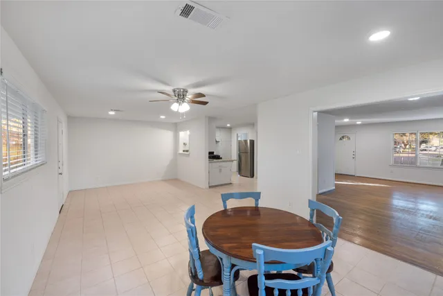 a kitchen with a sink granite counter tops and a white cabinets