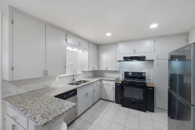 a bathroom with a sink vanity and a mirror