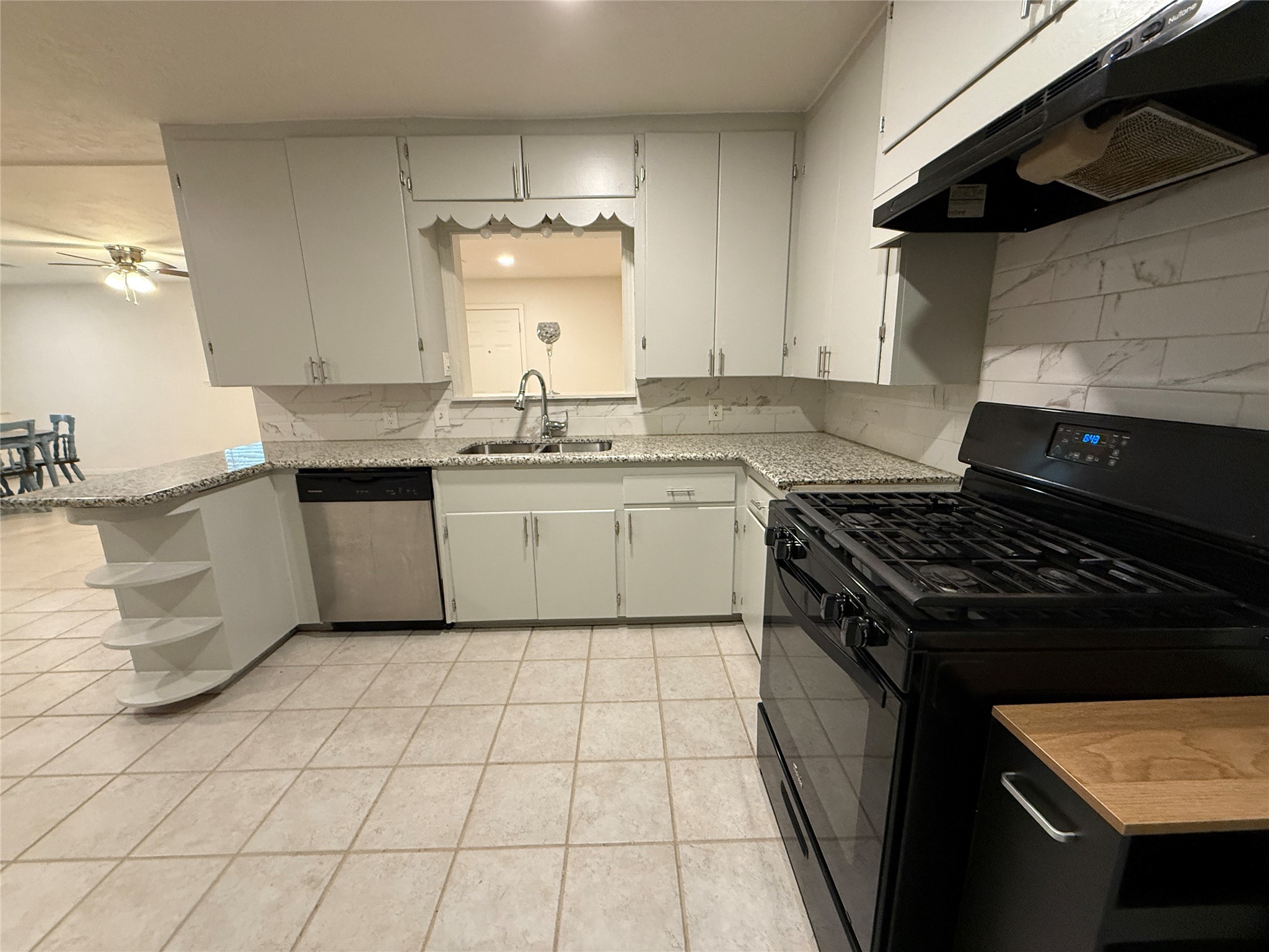 2310 Pecos La Marque, TX 77568 - Photo 9 of 26 a kitchen with a stove sink and cabinets