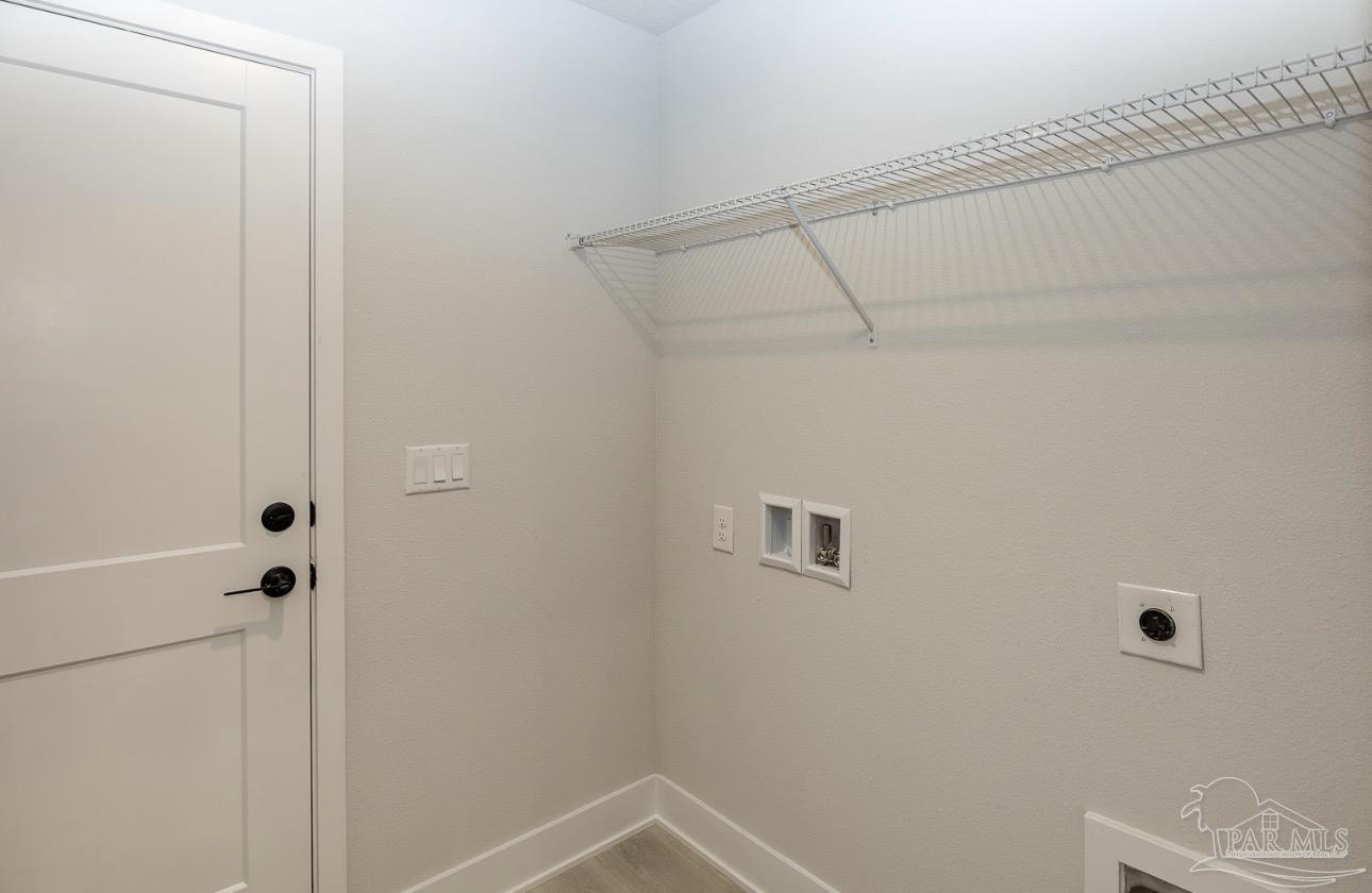 7657 Small Pnes Street Milton, FL 32583 - Photo 22 of 26 a bathroom with a shower and toilet