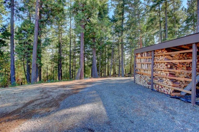 267 Citadel Road Trail, OR 97541 - Photo 24 of 30 a view of a backyard with large trees