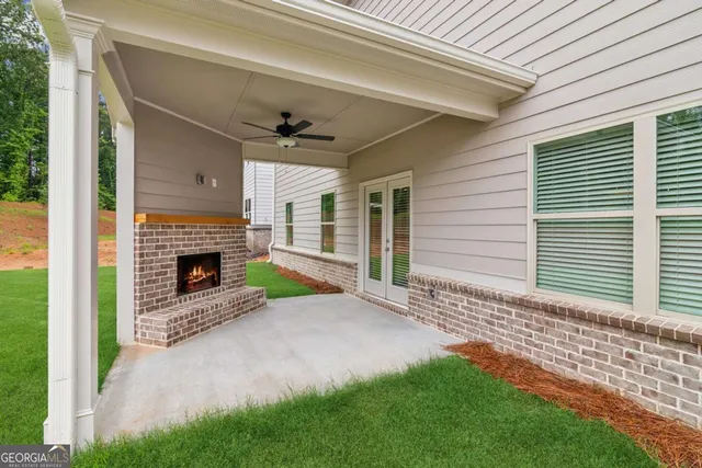a view of a porch with a fireplace and a window